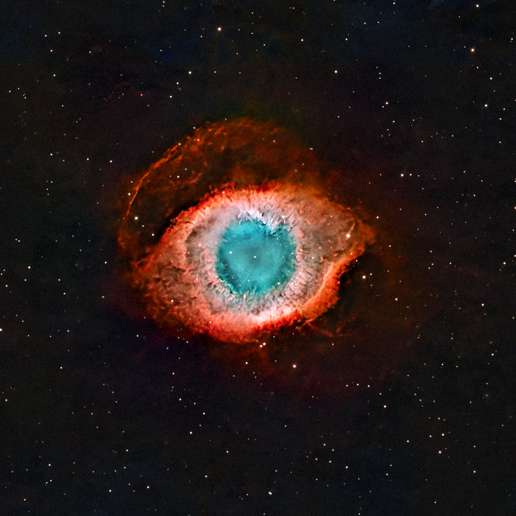 Helix Nebula fine art astrophotography print showing teal core and red outer shell in a square composition resembling an eye in deep space