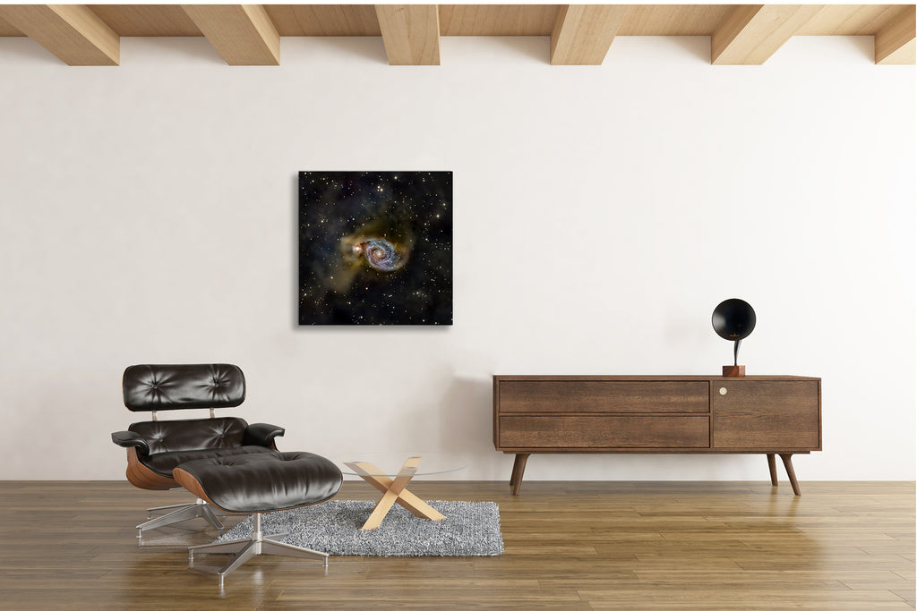 Whirlpool Galaxy M51 fine art astrophotography print showing spiral galaxy structure and companion galaxy displayed in a modern interior