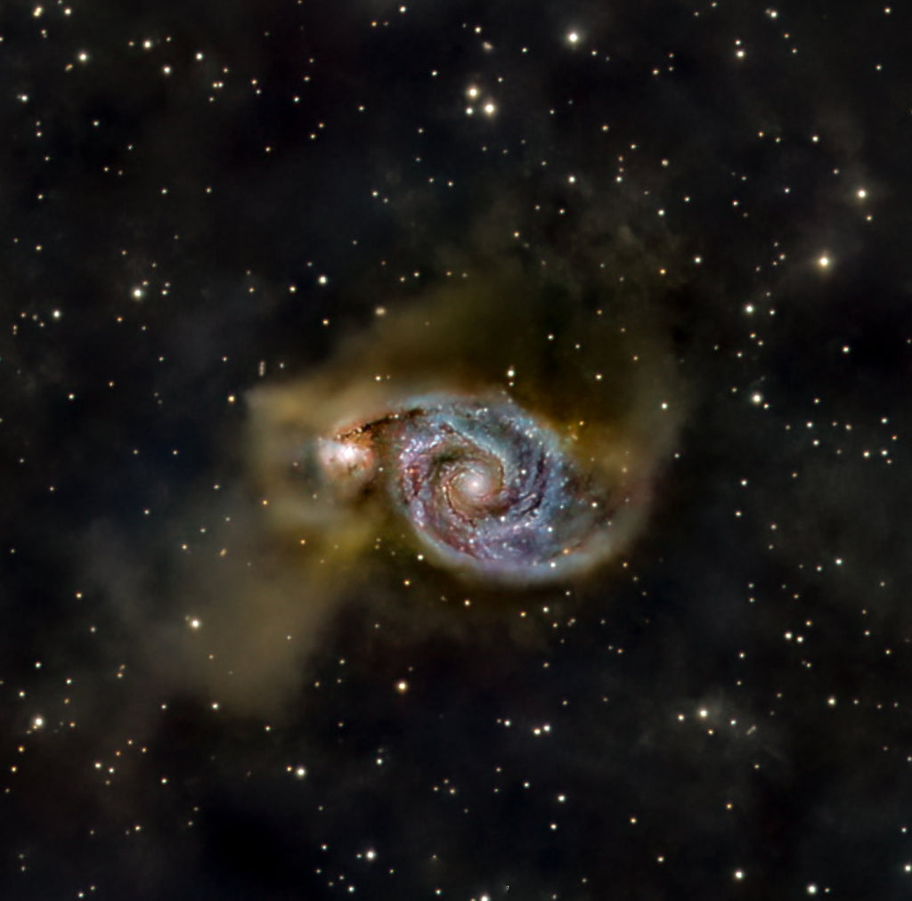 Whilrlpool Galaxy (51) interacting with companion galaxy NGC 5195, showing spiral structure and tidal bridge
