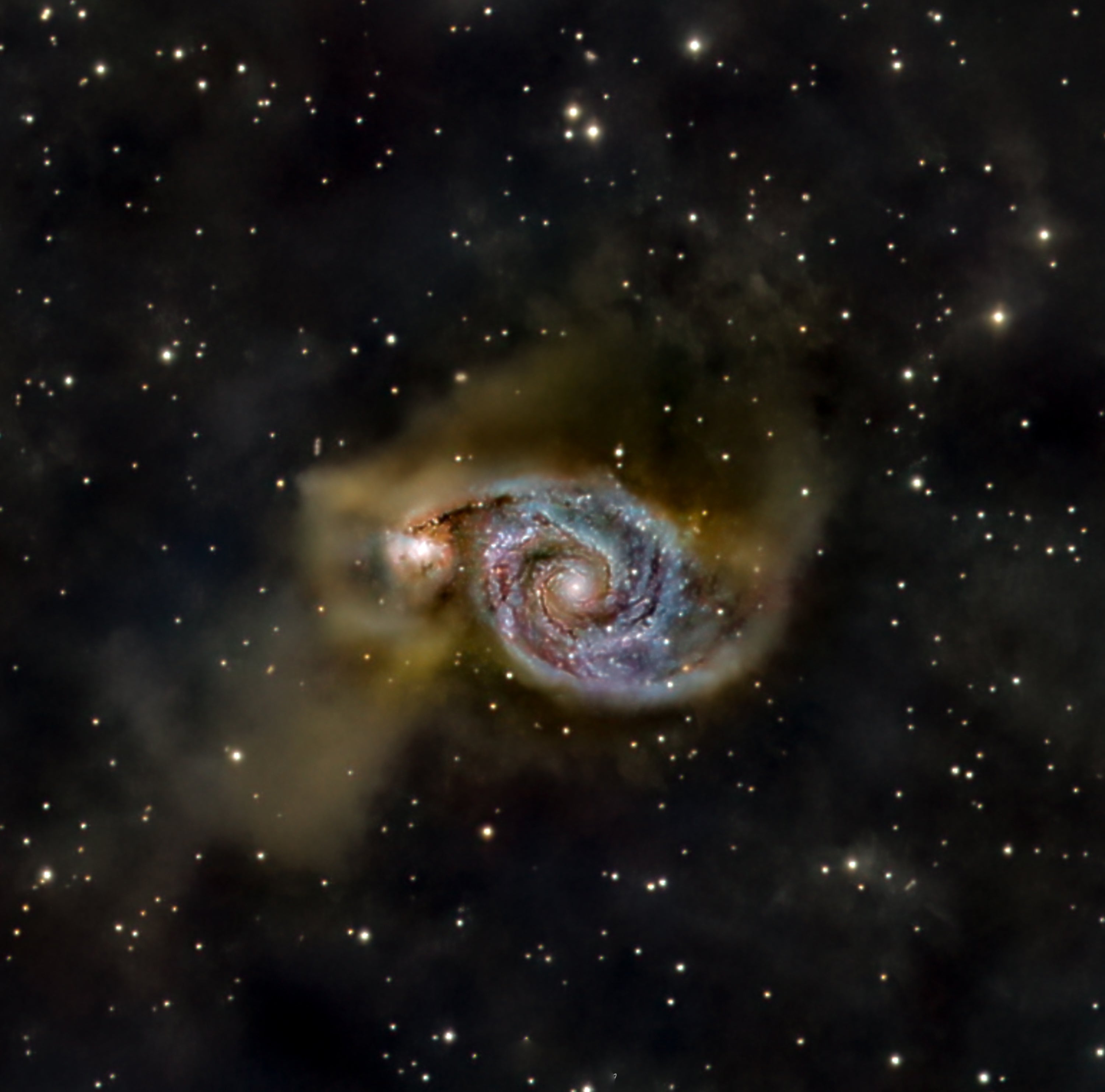 Whilrlpool Galaxy (51) interacting with companion galaxy NGC 5195, showing spiral structure and tidal bridge