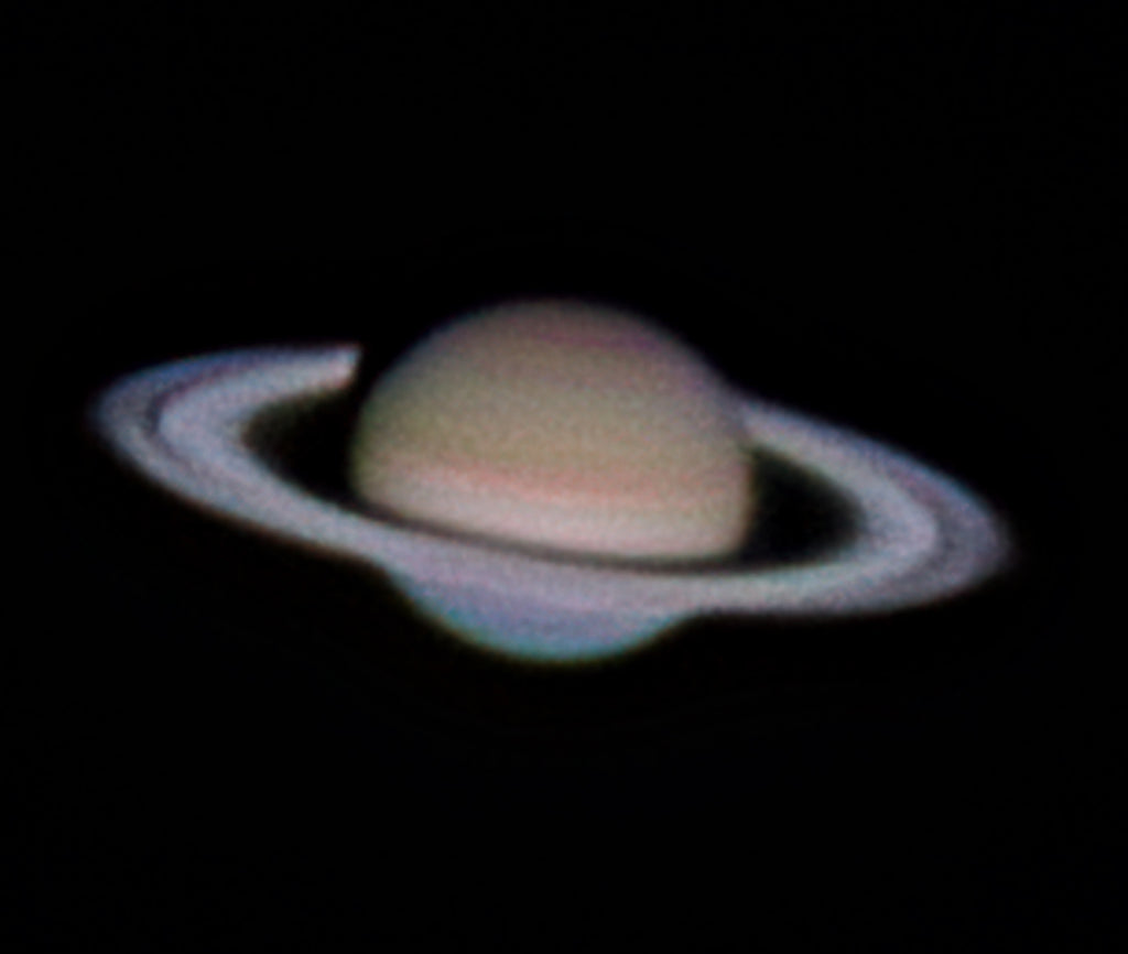 High-resolution astrophotography image of Saturn and its rings against a dark space background