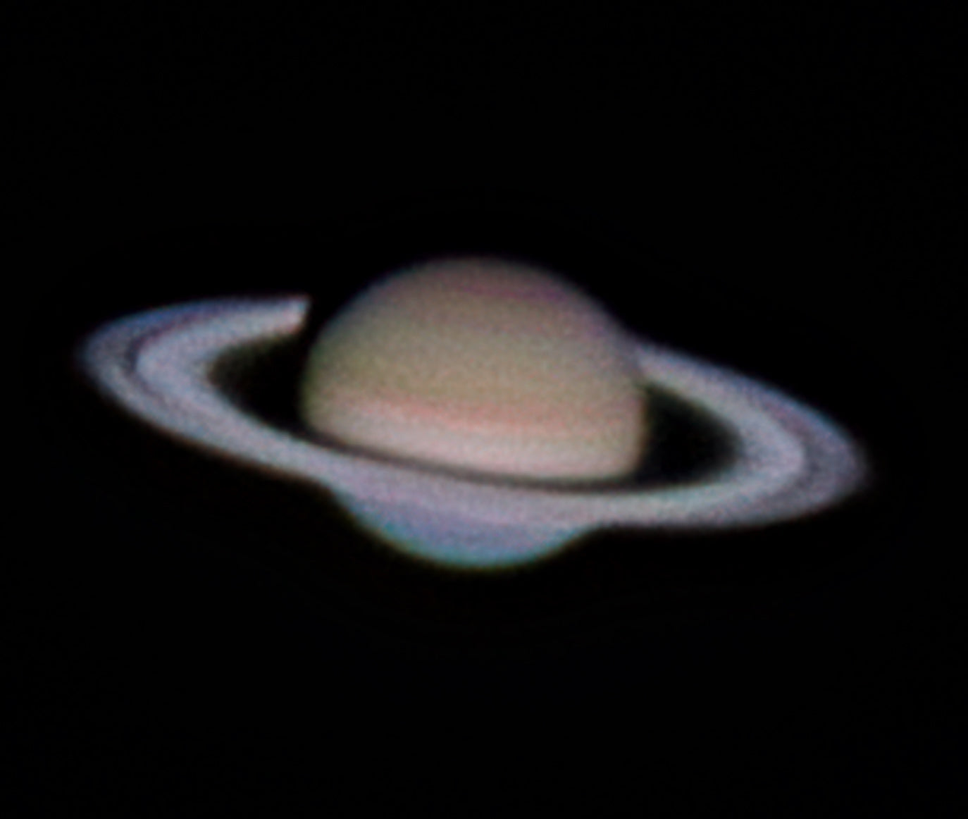 High-resolution astrophotography image of Saturn and its rings against a dark space background
